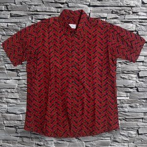 Red/Blue/Yellow Button Up (can’t read brand) Size Not Listed